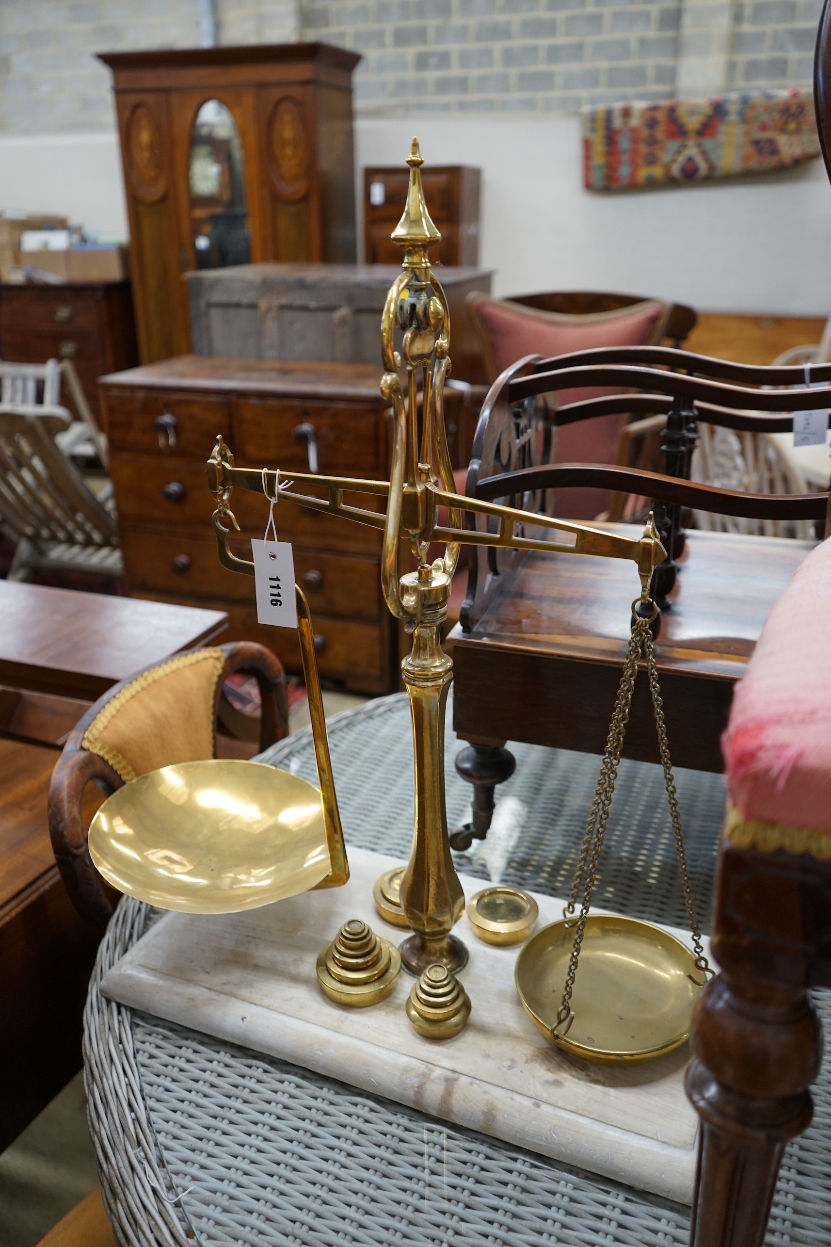 A set of Victorian brass balance scales with weights, height 69cm